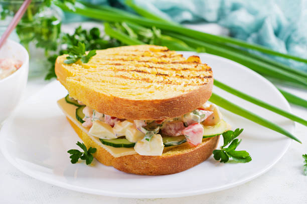 istock Breakfast toast. Healthy sandwich with tomato and egg salad with cheese for breakfast. 1318802917
