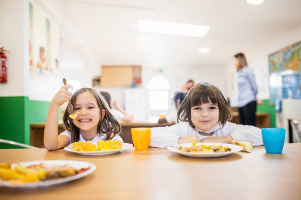 istock Primary school children on lunch break at school cafeteria 1318805078
