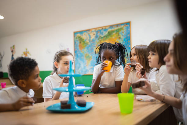 istock Primary school children on lunch break at school cafeteria 1318805157