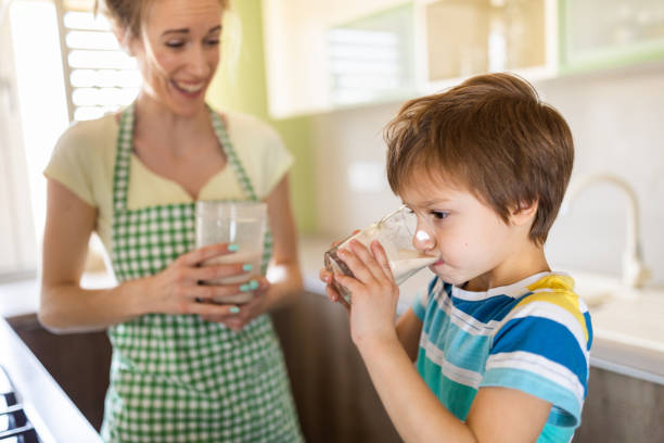 istock Little boy drinking healthy smoothie 1318806600