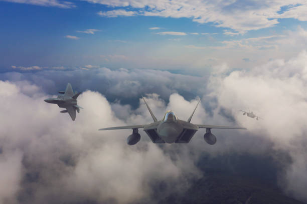 istock Jet fighters flying over the clouds. 1318806918