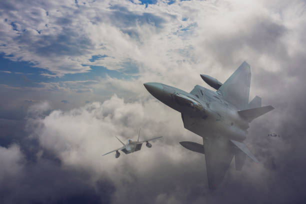 istock Jet fighters flying over the clouds. 1318808177