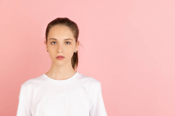 istock Caucasian young woman's portrait isolated over pink studio background with copyspace 1318811919