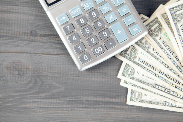 istock calculator and money on the desktop 1318817290