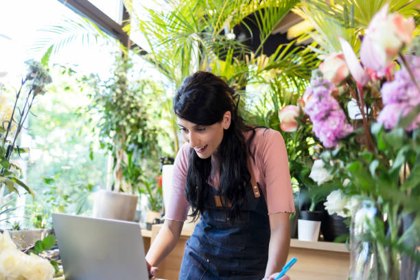 istock Female Florist Using Laptop 1318817316