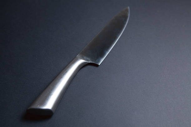 istock iron knife on black background 1318819434