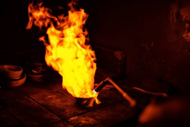Melting gold on traditional way using burner in jewelry manufacture industry