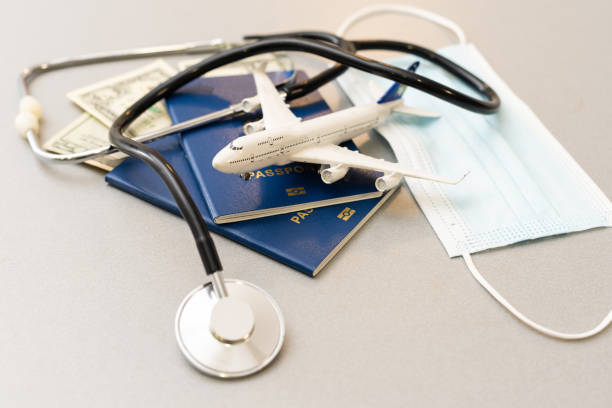 istock Passport, stethoscope and toy plane. 1318821050