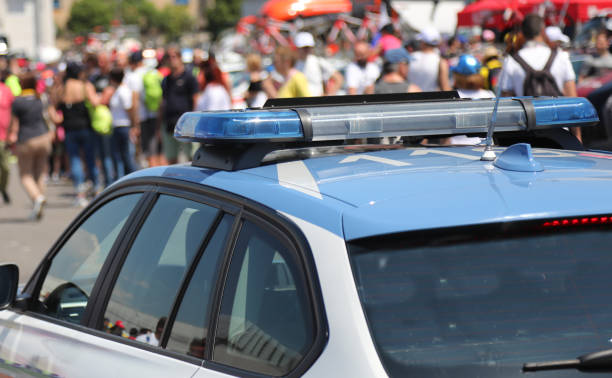 istock Police car  in the crowd during an unauthorized demonstration 1318821105