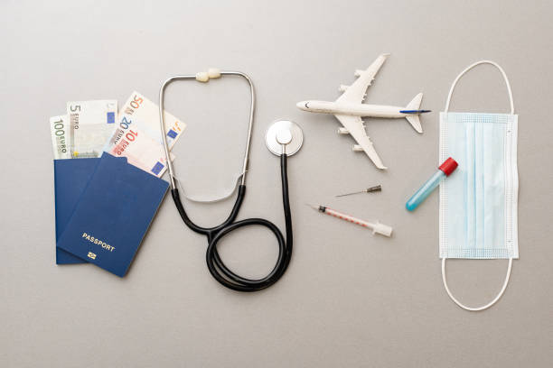 istock Passport, stethoscope and toy plane. 1318821232