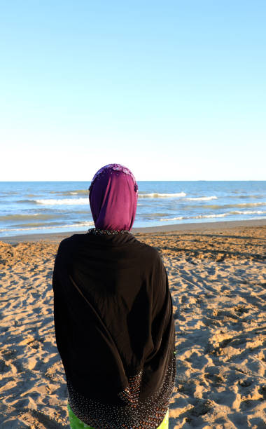istock woman looking at sea 1318821507