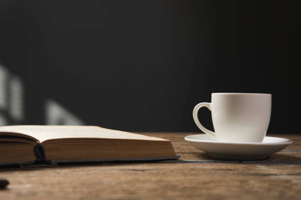 istock book and a cup of coffee on a wooden table 1318822877