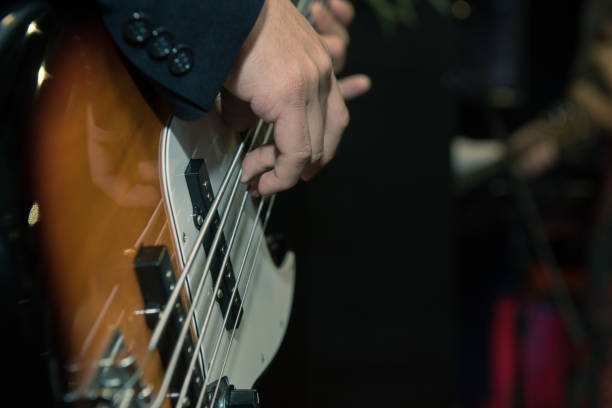 istock Man playing bass in low tone 1318826788