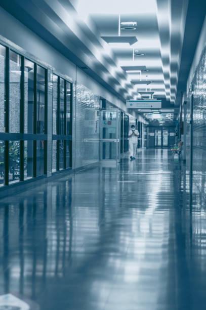 istock empty modern hospital corridor in coronavirus time 1318829181