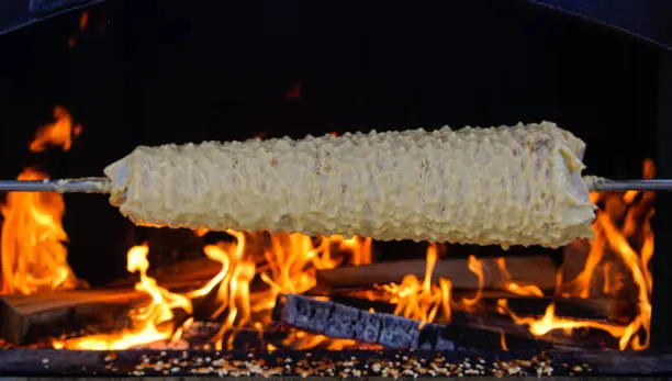 Photo of Cooking Sakotis in Vilnius, Lithuania. It is traditional spit cake.  Cuisine.