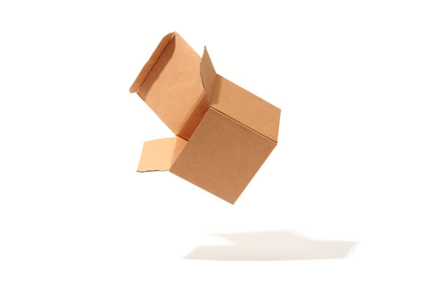 istock Open cardboard box in the air isolated on white 1318830557