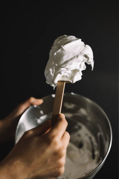 istock Professional pastry chef preparing the meringue for the cake 1318830583