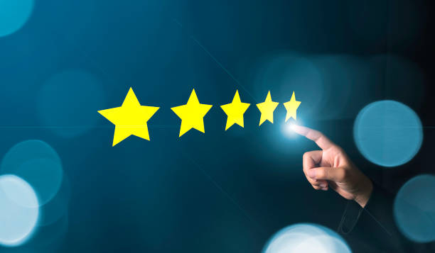 istock Customer review good rating concept hand pressing five star on visual screen and positive customer feedback testimonial. 1318831925