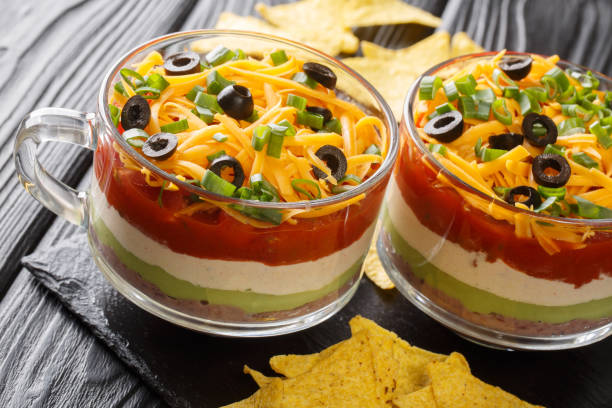 istock seven-layer dip is an American appetizer based on ingredients typical of Tex-Mex cuisine close up in the glass. Horizontal 1318831939