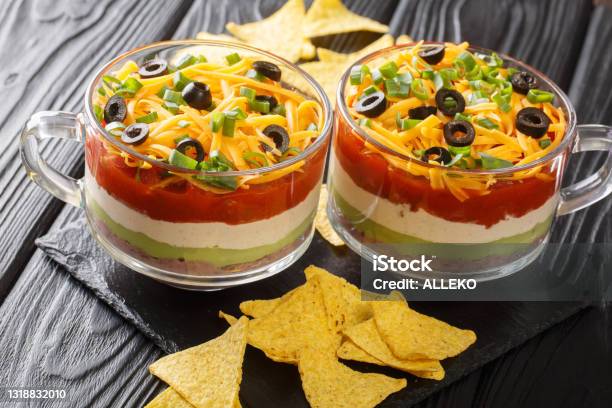 Delicious Food Appetizer Mexican Sevenlayer Dip Salad Served With Chips Closeup Horizontal Stock Photo - Download Image Now