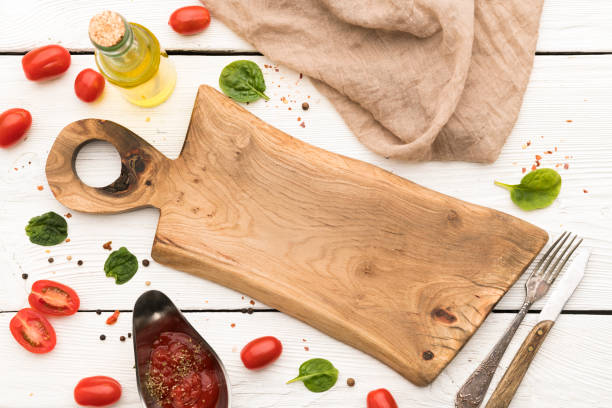istock Wooden cutting board and cooking ingredients 1318832557