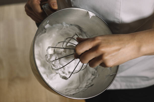 istock Professional pastry chef preparing the meringue for the cake 1318833762