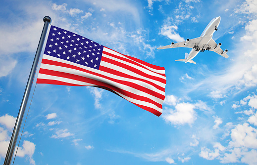 Airport radio tower in front of partly cloudy sky with departing airplane as concept for flight safety airspace surveillance and air traffic