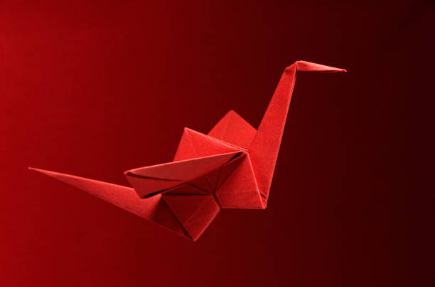 istock Red Origami On Red Background 1318835692