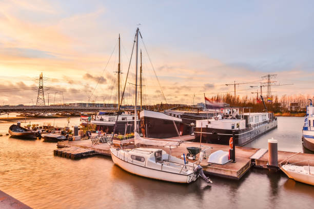 istock Modern vessels near quay at sunset 1318835706
