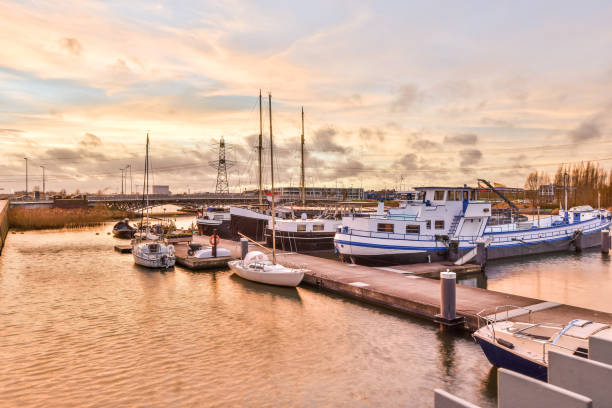 istock Pier with vessels at sundown 1318835938