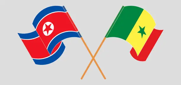 Vector illustration of Crossed and waving flags of North Korea and Senegal