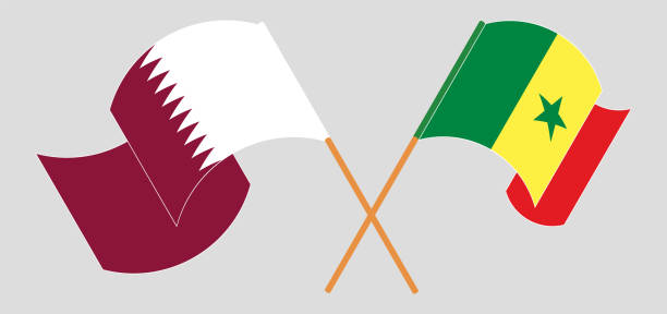 skrzyżowane i machające flagami kataru i senegalu - qatar senegal stock illustrations