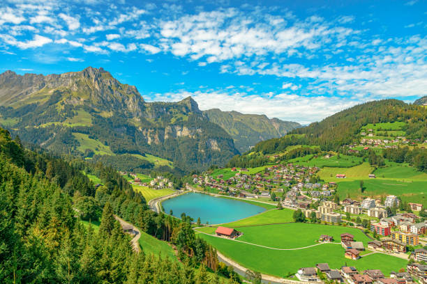 Engelberg Valley of Switzerland Valley of Engelberg with Eugenisee lake. View from cable car to Titlis mountain of the Uri Alps. Located in cantons of Obwalden and Bern, Switzerland, Europe. Summer season, clear blue sky. engelberg photos stock pictures, royalty-free photos & images