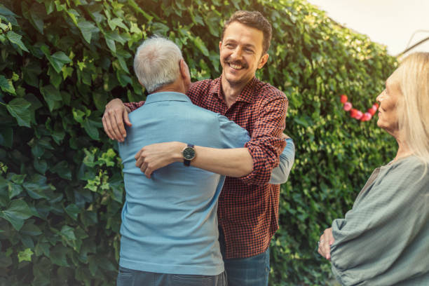istock Man embracing father at birthday party 1318839045