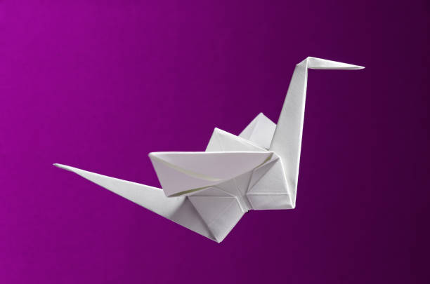 istock White Origami On Pink Background 1318840116