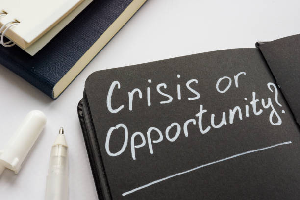 istock Crisis or opportunity question on the black page. 1318841219