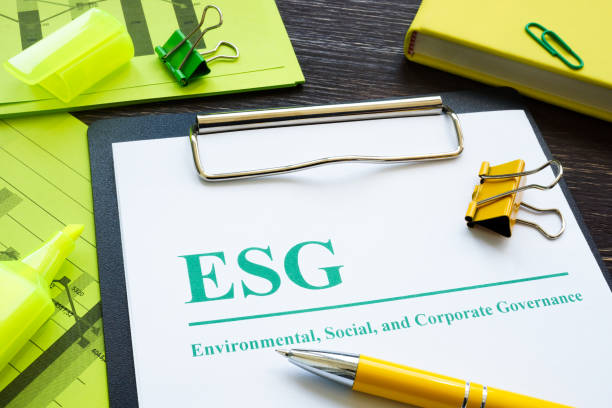 Papers about ESG Environmental, Social and Corporate Governance and notepad. Papers about ESG Environmental, Social and Corporate Governance and notepad. environmental social corporate governance esg stock pictures, royalty-free photos & images