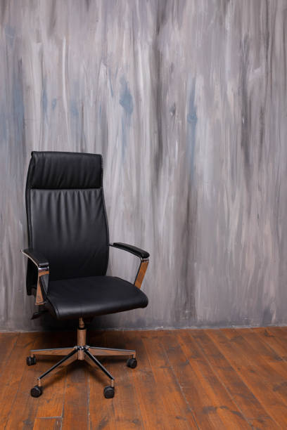 istock black office chair on gray coated mottled background 1318842413