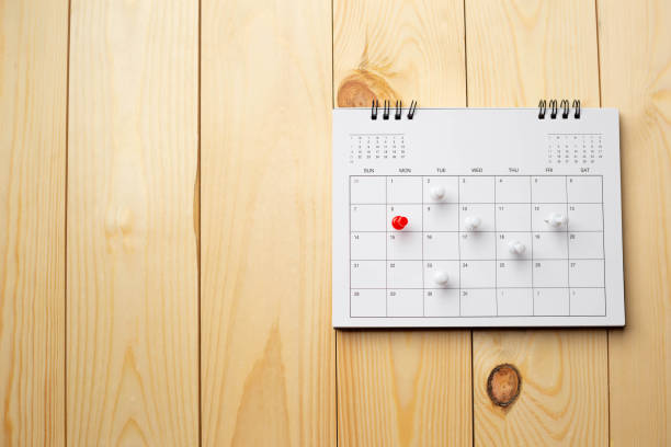 istock Calendar on wooden table with copy space. 1318845541