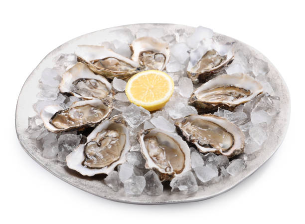 istock Fresh raw oysters served on white background 1318850067