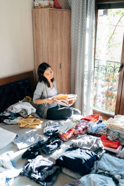 istock Young Woman Sitting On Table At Home 1318853806