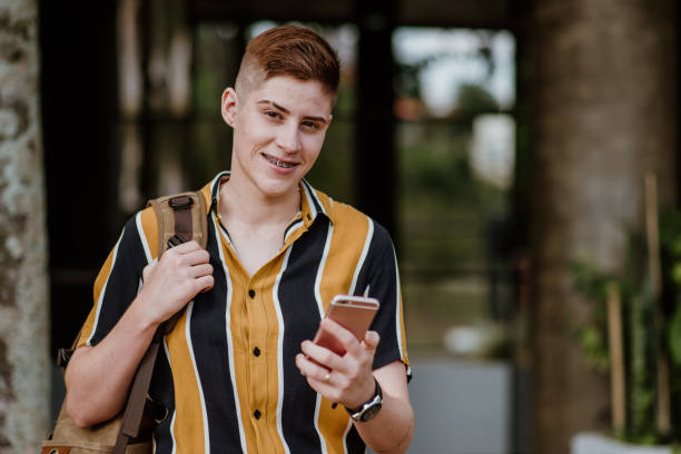 istock Young Adults lifestyle - Student using mobile phone 1318856008
