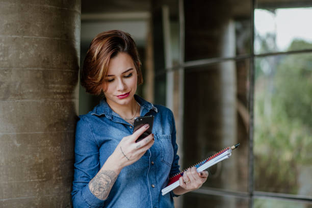 istock Young Adults lifestyle - Student using mobile phone 1318856027