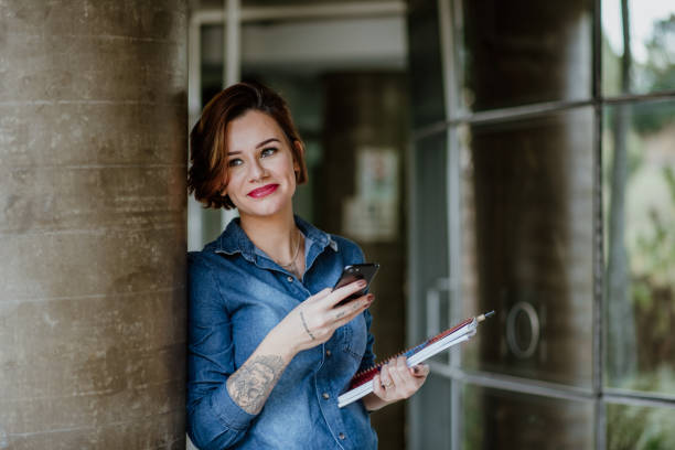 istock Young Adults lifestyle - Student using mobile phone 1318856119