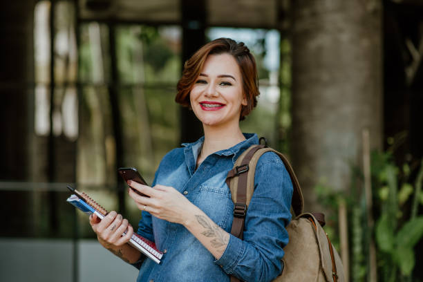 istock Young Adults lifestyle - Student using mobile phone 1318856196