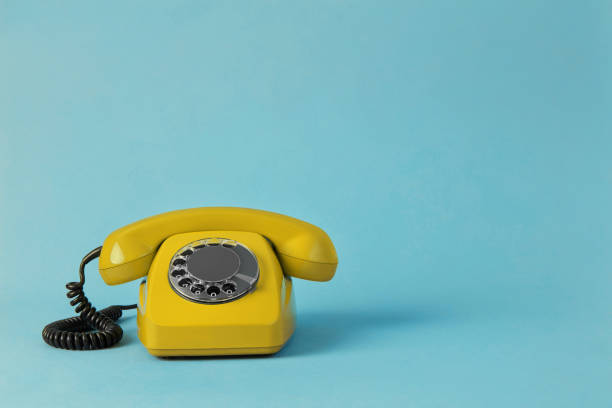 istock Vintage yellow telephone 1318857154