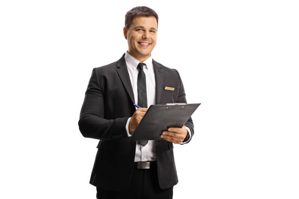 istock Young elegant man with a name tag on his suit holding a clipboard 1318858144