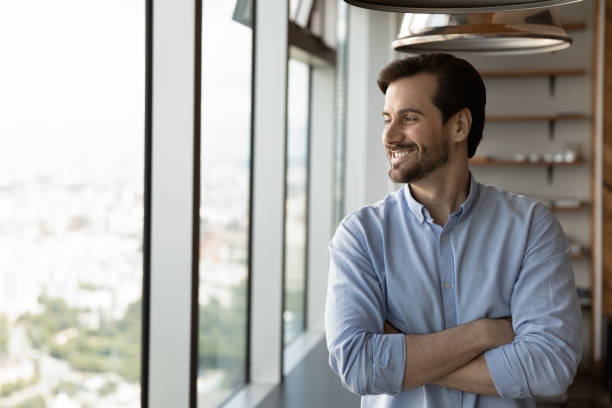 istock Smiling businessman look in distance making plans 1318858229