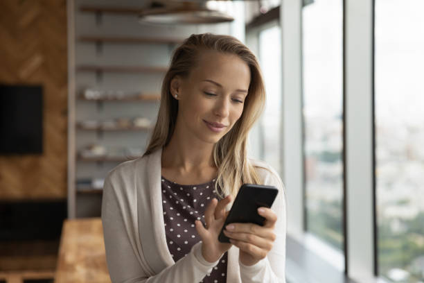 istock Young woman use smartphone browsing internet online 1318858337