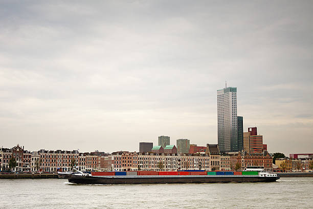istock Cargo Ship sailing on a Canal, Background Skyscrapers 131885992